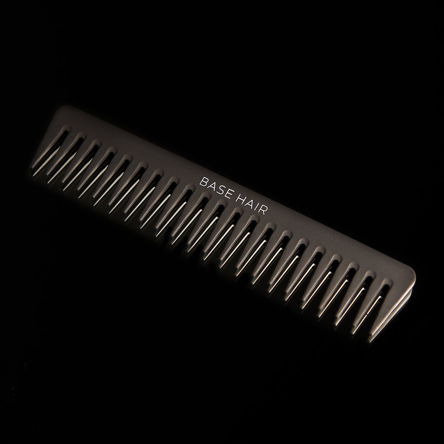 wide tooth hair comb on black background